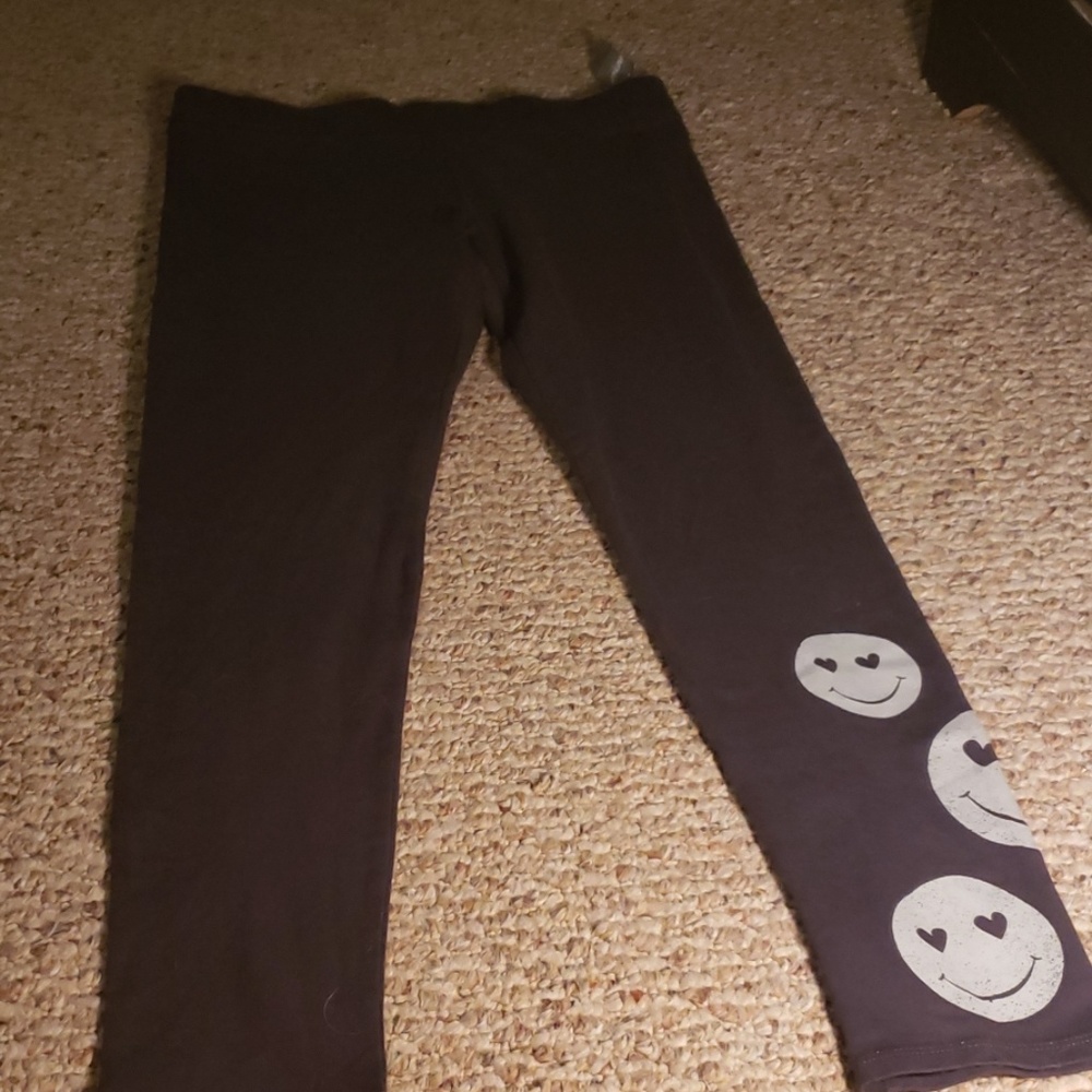 Casual black pants with  cute smiles  on the botto
